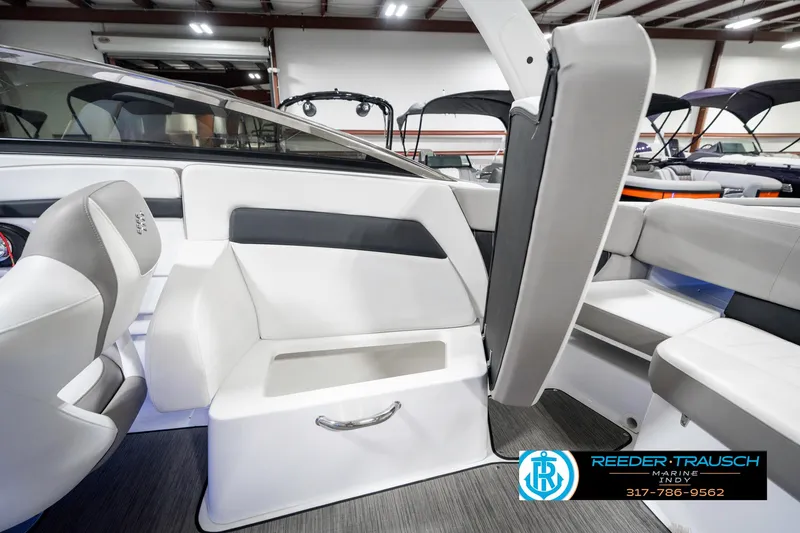 Slide: The Image of 2021 Four Winns H260 boat interior with sleek seating and modern design. - 29