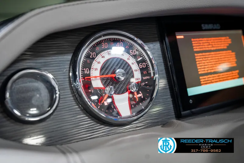 Slide: The Image of Dashboard of 2021 Four Winns H260 boat with speedometer and digital display. - 43