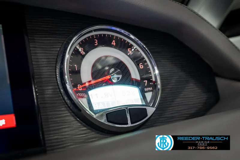 Slide: The Image of Tachometer of 2021 Four Winns H260 boat, displaying RPM and battery status. - 45