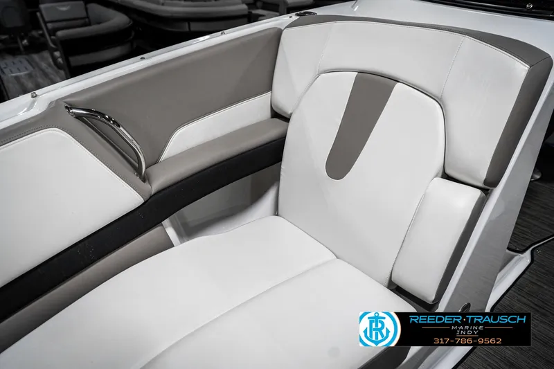 Slide: The Image of 2021 Four Winns H260 boat interior with white and gray seating. - 48