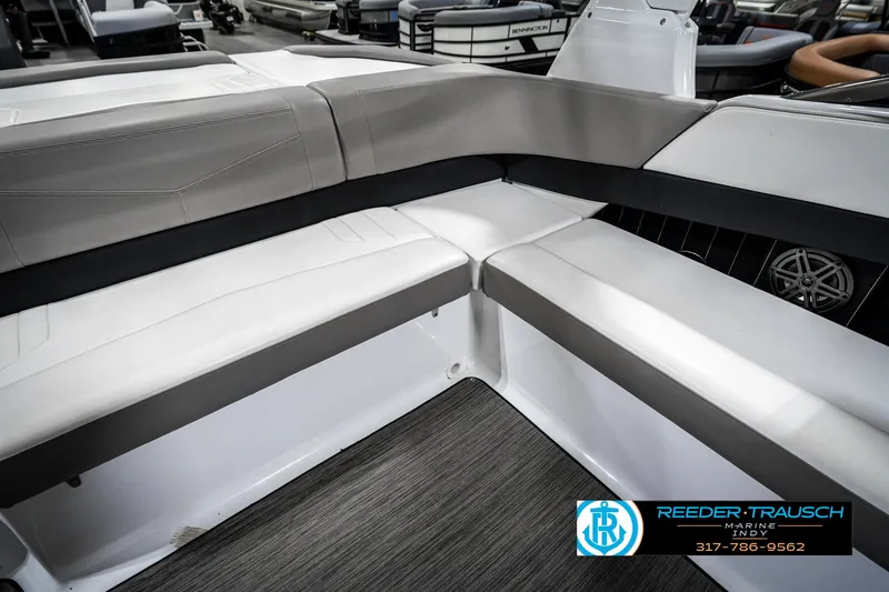 Slide: The Image of 2021 Four Winns H260 boat interior with gray and white seating, showcased at Reeder-Trausch Marine. - 49