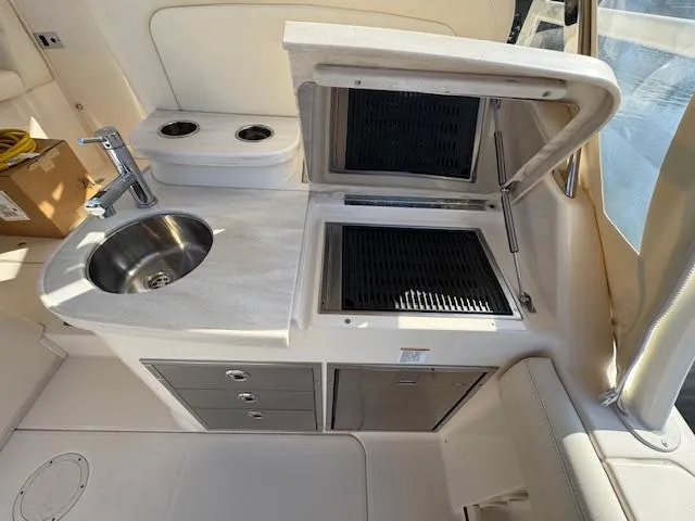 Slide: The Image of 2021 Grady-White Freedom 335 boat interior with sink and grill station. - 18