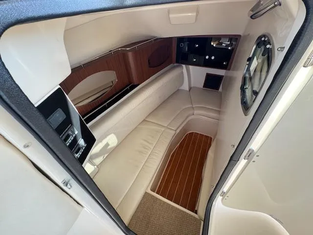 Slide: The Image of Interior cabin of 2021 Grady-White Freedom 335 boat, featuring plush seating and wood accents. - 20