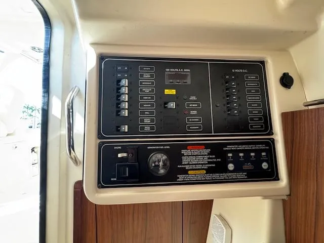 Slide: The Image of Electrical control panel on a 2021 Grady-White Freedom 335 boat interior. - 23