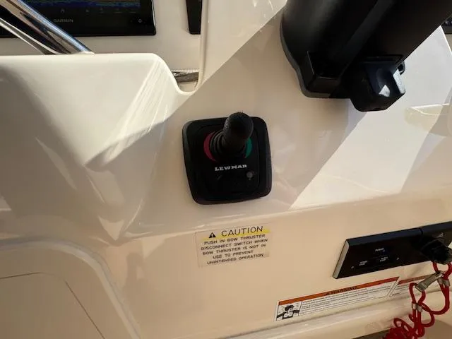 Slide: The Image of Control panel of a 2021 Grady-White Freedom 335 boat with Lewmar joystick. - 29