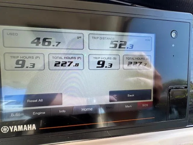 Slide: The Image of Yamaha boat display showing fuel usage and trip data on a 2021 Grady-White Freedom 335. - 30
