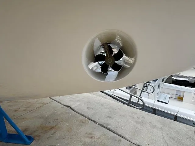 Slide: The Image of Bow thruster on a 2021 Grady-White Freedom 335 boat, docked on a concrete surface. - 41