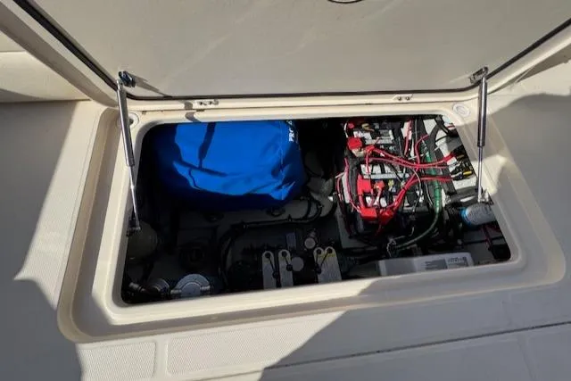 Slide: The Image of Open engine compartment of 2021 Grady-White Freedom 335 boat, showing wiring and components. - 44