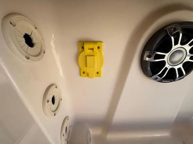 Slide: The Image of Interior of 2021 Grady-White Freedom 335 boat with speaker and yellow fixture. - 49