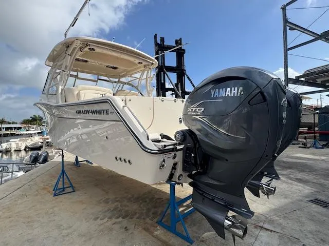 Slide: The Image of 2021 Grady-White Freedom 335 boat with Yamaha engines on a dock. - 9