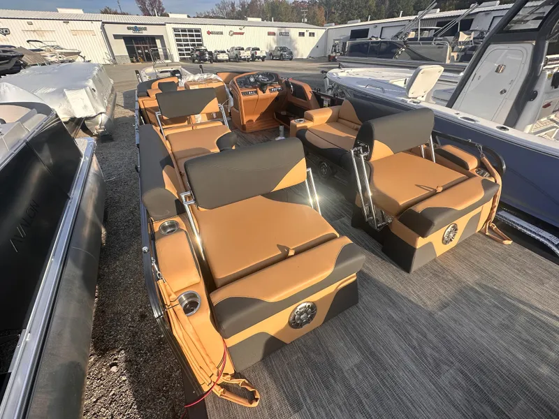 Slide: The Image of 2025 Avalon LSZ Quad Lounger Shift pontoon boat with luxurious seating and modern design. - 5