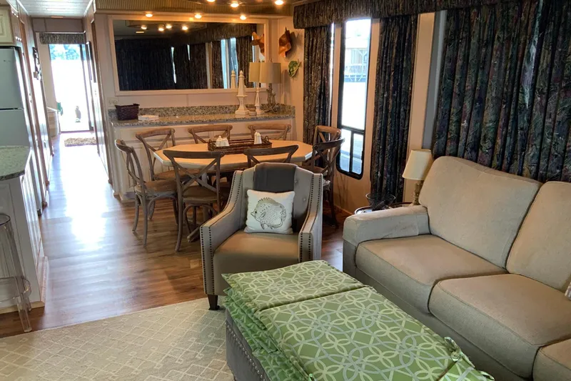 Slide: The Image of Interior of a 1997 Lakeview 16 x 65 houseboat with cozy living and dining area. - 13