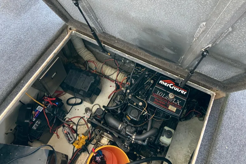Slide: The Image of Engine compartment of a 1997 Lakeview 16 x 65 houseboat with MerCruiser 3.0L engine. - 49