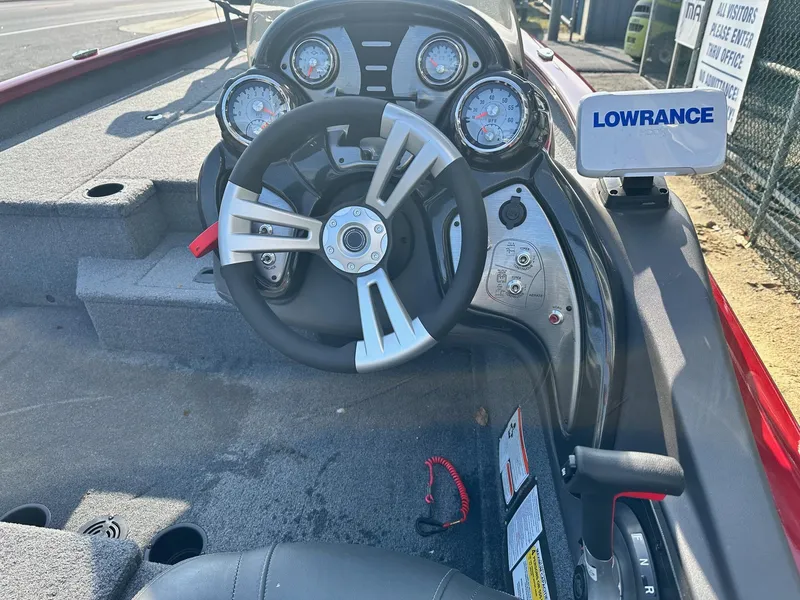 Slide: The Image of 2019 Tracker TXW175 Tournament Edition boat dashboard with steering wheel and Lowrance display. - 5
