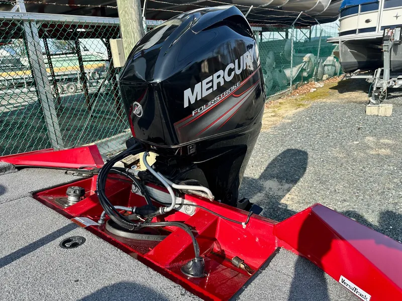 Slide: The Image of 2019 Tracker TXW175 Tournament Edition with Mercury outboard motor, parked outdoors. - 8