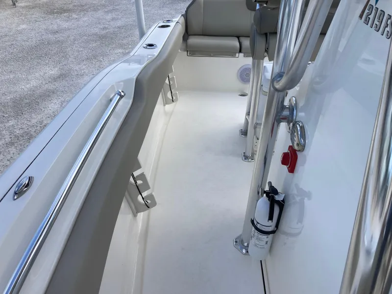 Slide: The Image of 2022 Key West 219fs boat interior with seating and safety equipment. - 14