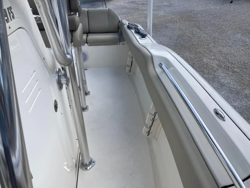 Slide: The Image of 2022 Key West 219fs boat interior with seating and stainless steel railings. - 15