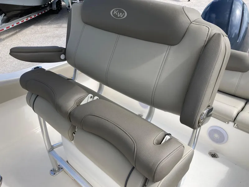 Slide: The Image of 2022 Key West 219fs boat seating with gray cushioned upholstery. - 18