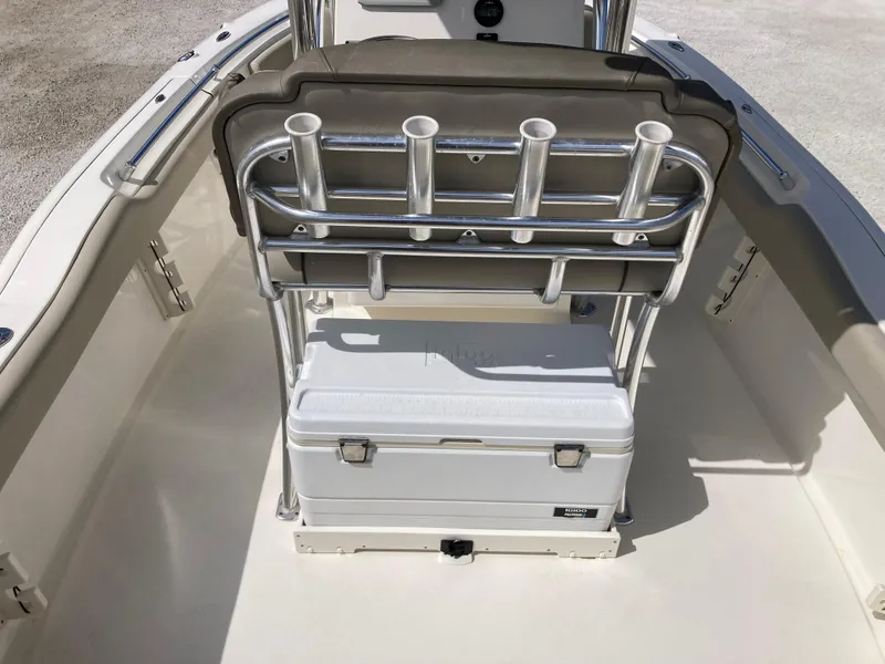 Slide: The Image of 2022 Key West 219fs boat interior with rod holders and cooler storage. - 6