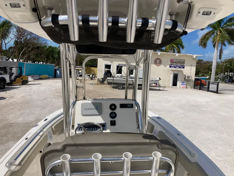 Slide: The Image of 2022 Key West 219fs boat interior with Garmin system, docked outdoors. - 7