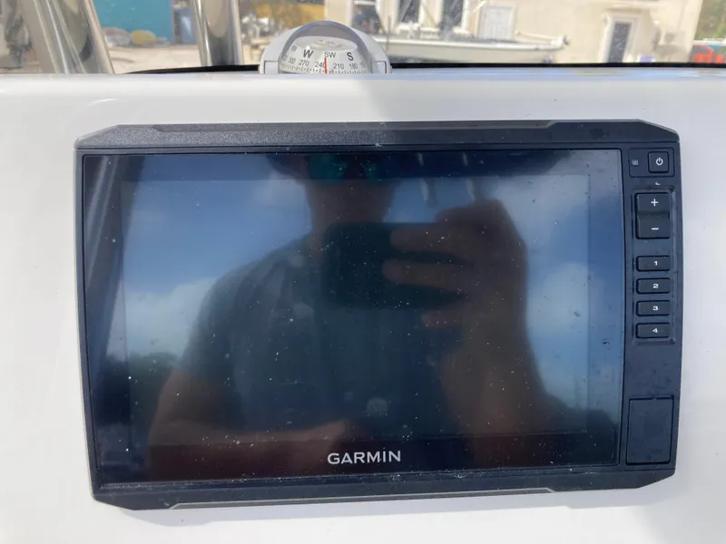 Slide: The Image of Garmin navigation display on 2022 Key West 219fs boat dashboard. - 9
