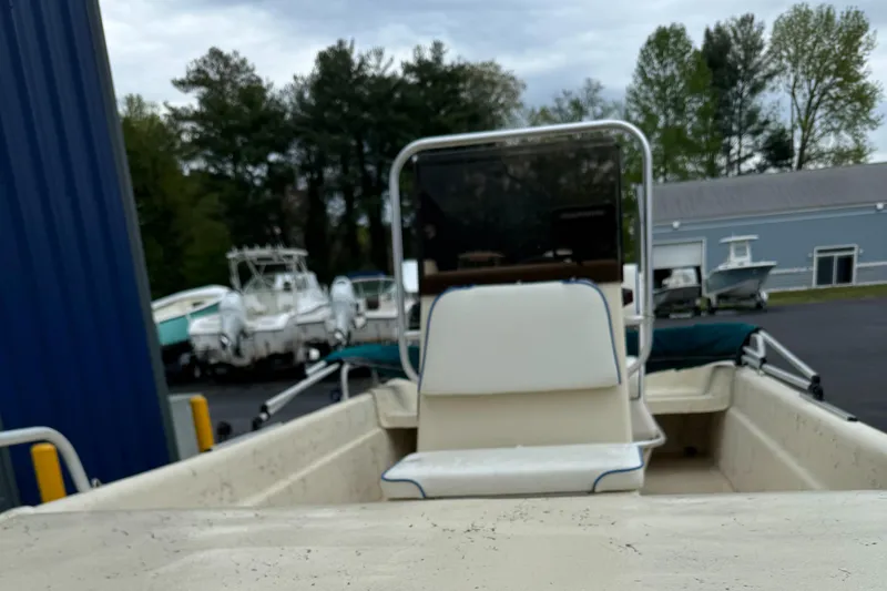 Slide: The Image of 2001 Carolina Skiff 17 Center Console with new Suzuki 40HP engine, parked outdoors. - 3