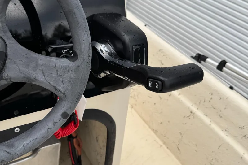 Slide: The Image of Steering wheel and throttle of 2001 Carolina Skiff 17 Center Console boat. - 5