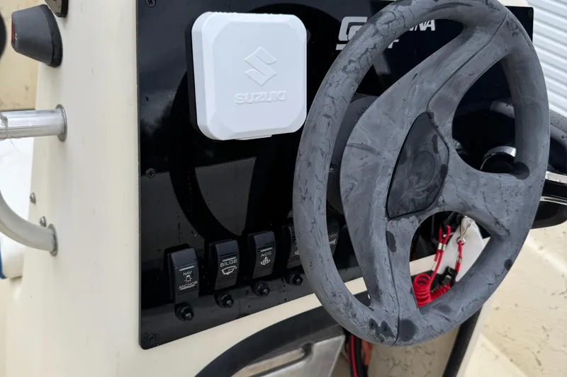 Slide: The Image of 2001 Carolina Skiff 17 Center Console with Suzuki 40HP, steering wheel and controls. - 7