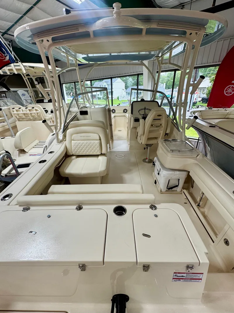 Slide: The Image of 2025 Grady-White Freedom 235 boat interior with seating and helm station. - 4