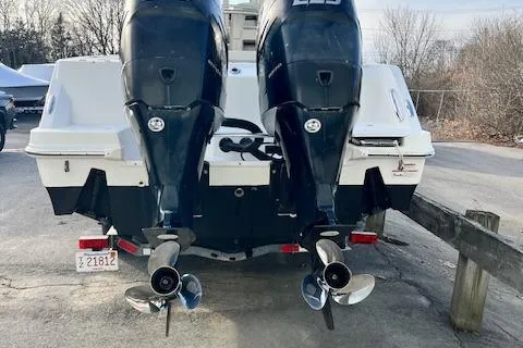Slide: The Image of 2016 Boston Whaler 250 Outrage with dual outboard engines, rear view. - 5