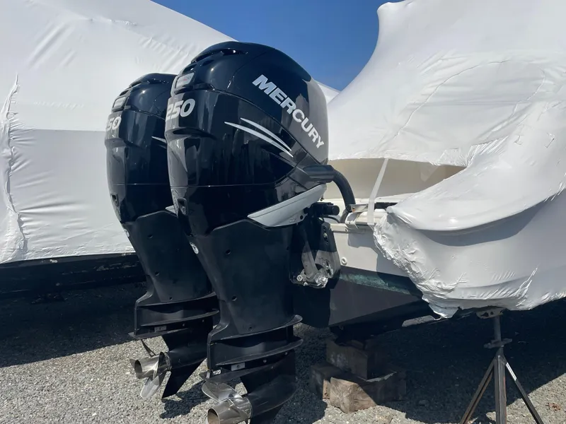 Slide: The Image of Twin Mercury 250 outboard engines on a 2008 Boston Whaler 320 Outrage Cuddy Cabin. - 5