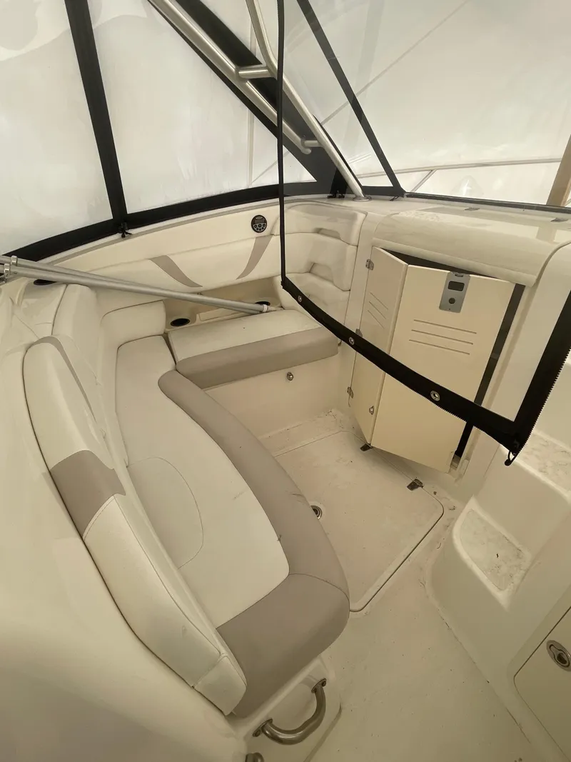 Slide: The Image of 2008 Boston Whaler 320 Outrage Cuddy Cabin interior with seating and storage. - 7