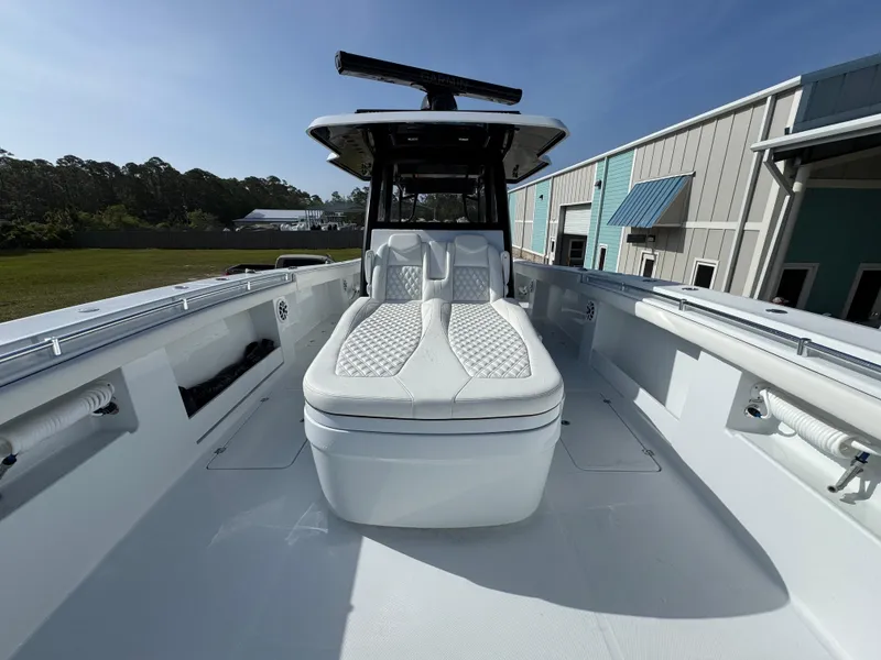 Slide: The Image of 2025 Invincible 46 Catamaran with sleek white deck and luxurious seating. - 20