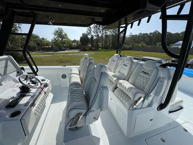 Slide: The Image of 2025 Invincible 46 Catamaran interior with luxurious seating and modern helm controls. - 29