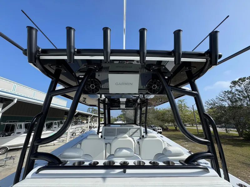 Slide: The Image of 2025 Invincible 46 Catamaran with advanced Garmin navigation system and sleek design. - 31