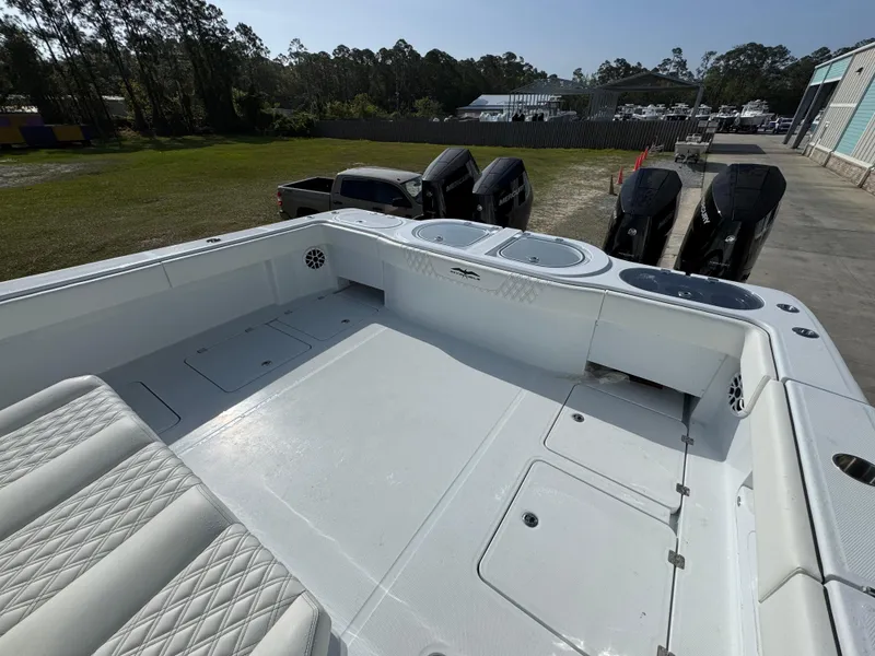 Slide: The Image of 2025 Invincible 46 Catamaran with spacious deck and powerful outboard engines. - 32