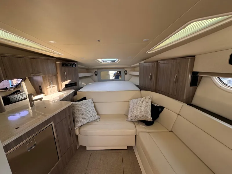 Slide: The Image of Luxurious interior of 2019 Regal 35 Sport Coupe with modern kitchen and cozy seating. - 10