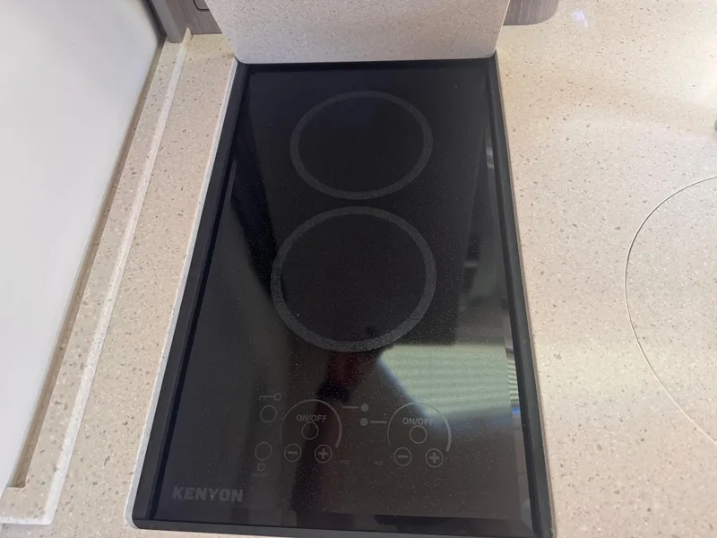 Slide: The Image of Kenyon electric cooktop on 2019 Regal 35 Sport Coupe yacht kitchen counter. - 12