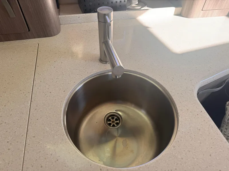 Slide: The Image of Stainless steel sink and faucet on Regal 35 Sport Coupe 2019 yacht. - 13