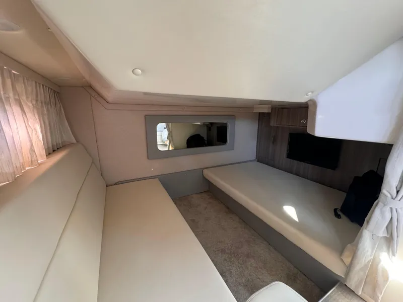 Slide: The Image of Interior of 2019 Regal 35 Sport Coupe, featuring cozy seating and modern design. - 16