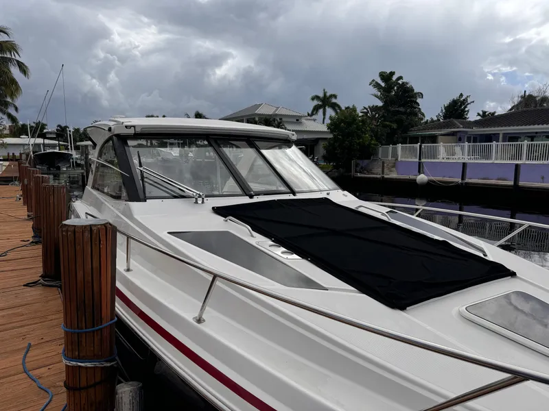 Slide: The Image of 2019 Regal 35 Sport Coupe docked, featuring sleek design and modern amenities. - 9