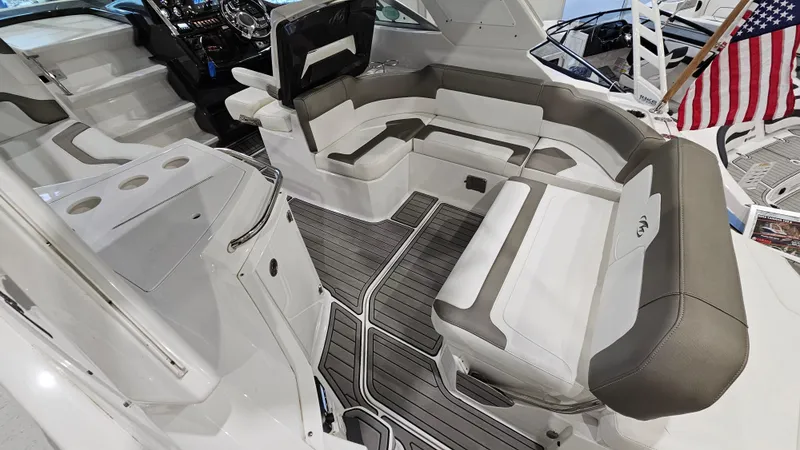 Slide: The Image of 2020 Monterey 295 Sport Yacht interior with sleek seating and modern design. - 12