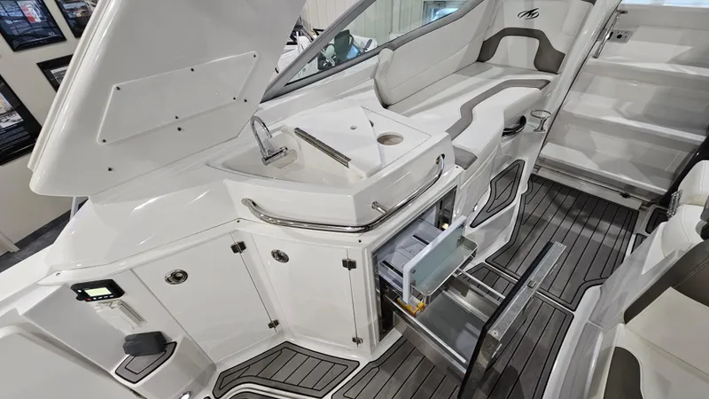 Slide: The Image of 2020 Monterey 295 Sport Yacht interior with sleek kitchen and seating area. - 15