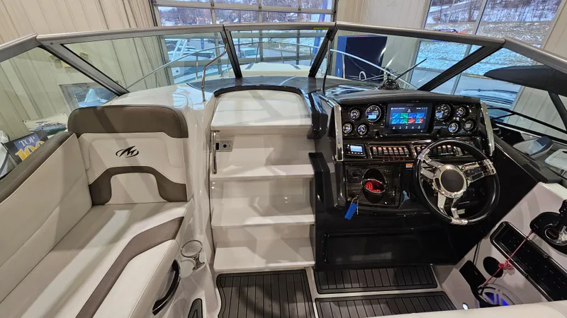 Slide: The Image of 2020 Monterey 295 Sport Yacht cockpit with modern controls and seating. - 20
