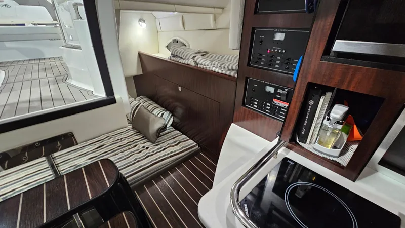 Slide: The Image of Interior of 2020 Monterey 295 Sport Yacht with cozy cabin and modern amenities. - 28