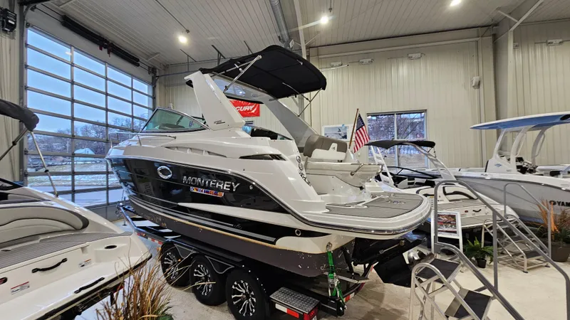 Slide: The Image of 2020 Monterey 295 Sport Yacht displayed indoors, showcasing sleek design and modern features. - 3