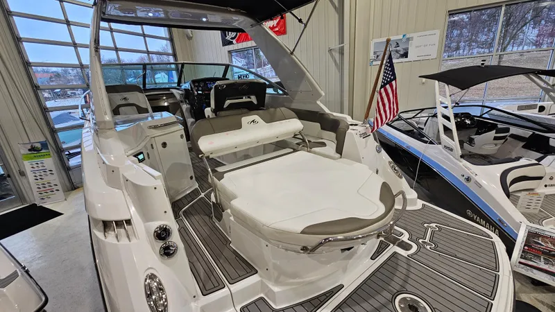 Slide: The Image of 2020 Monterey 295 Sport Yacht interior with seating, displayed indoors. - 6
