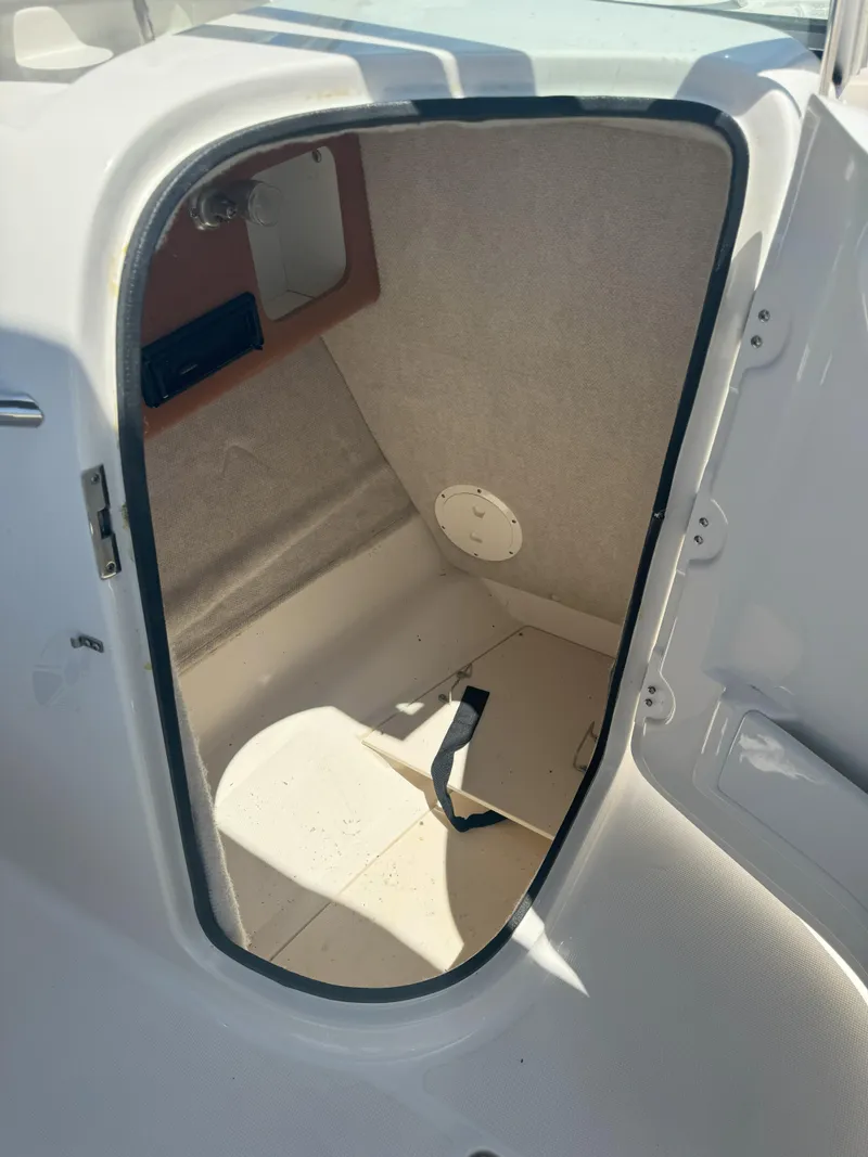 Slide: The Image of 2009 Robalo R227 Dual Console boat storage compartment interior. - 10