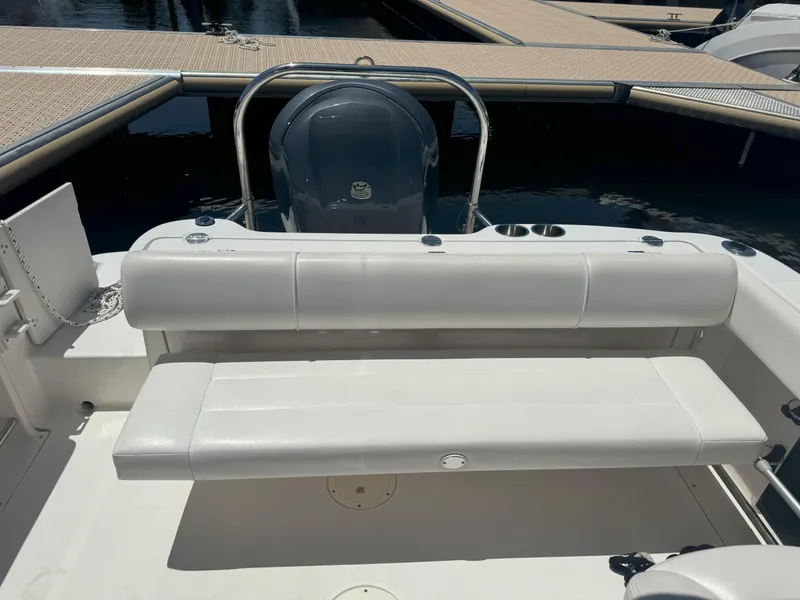 Slide: The Image of 2009 Robalo R227 Dual Console boat with white seating at the dock. - 5