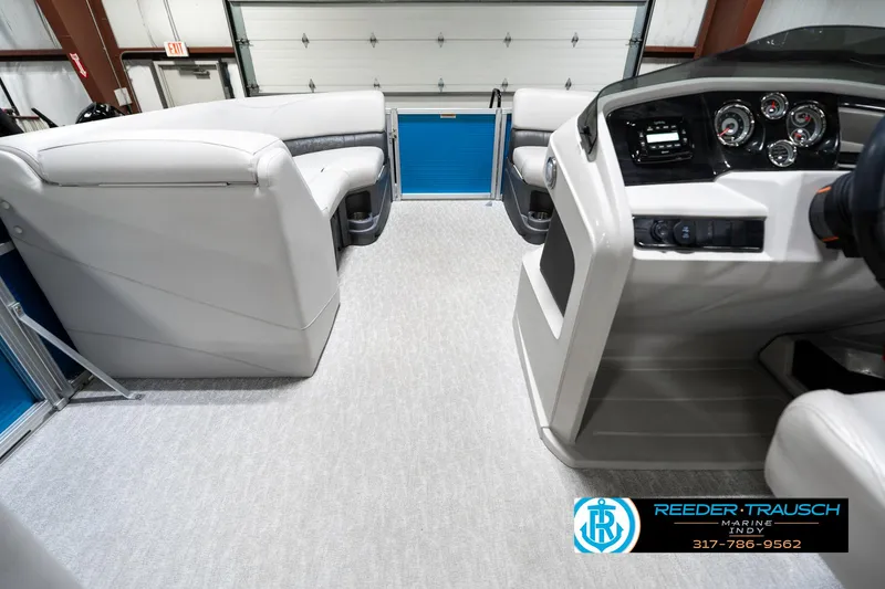 Slide: The Image of Interior view of 2025 Avalon 2285 LSZ CRB pontoon boat with modern seating and dashboard. - 20